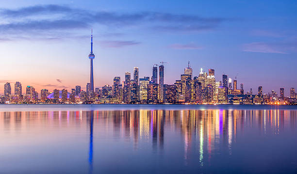 toronto skyline with purple light toronto, ontario, canada